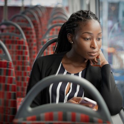 Black-woman-thinking-on-bus
